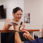 patient speaks with receptionist about accelerated tms protocols