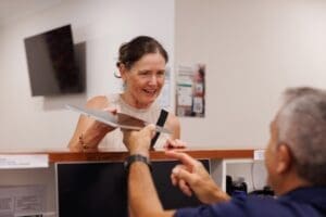 patient speaks with receptionist about accelerated tms protocols