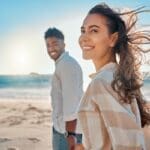 Shot of a young couple spending time together at the beach, demonstrating how ketamine can improve quality of life for people with Depression