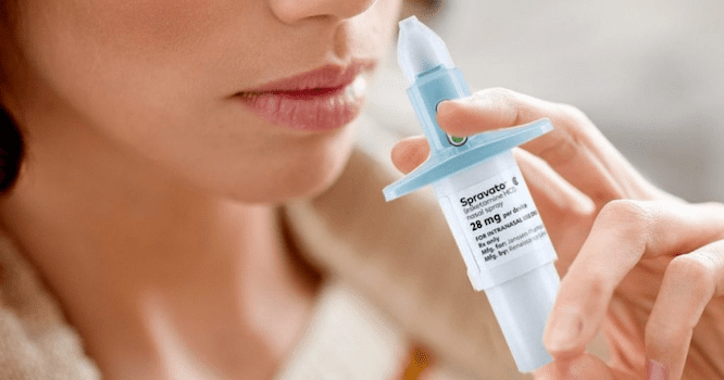 A person raising nasal spray to demonstrate the efficacy of Spravato for NYC patients