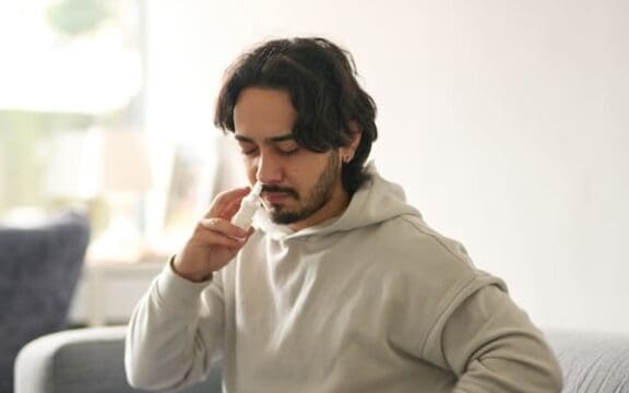 Man using Spravato to demonstrate the Spravato experience in his doctor's office